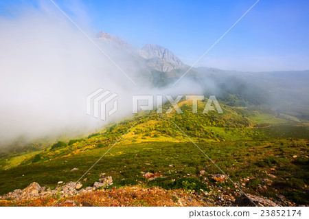Fog over mountains in summer Fog over mountains in summer 23852174