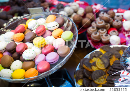 Close up view at fruit jellies and macaroons 23853555