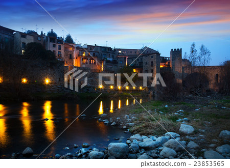 Evening photo of medieval town with bridge. Besalu Evening photo of medieval town with bridge. Besalu 23853565