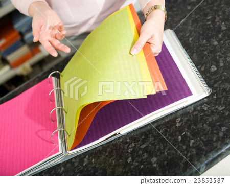 Cloth specimens in textile store. 23853587