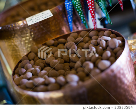 Chocolate beads filled in cacao close up Chocolate beads filled in cacao close up 23853594