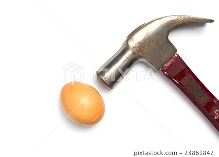 Hammer hitting an egg on white background. 23861842