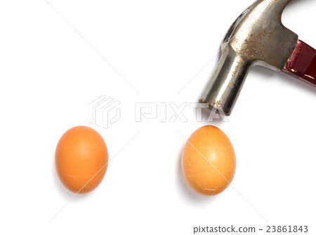 Hammer is breaking 2 Eggs on white background. Hammer is breaking 2 Eggs on white background. 23861843