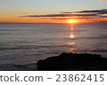 Sunset and rock sinking in the sea 23862415