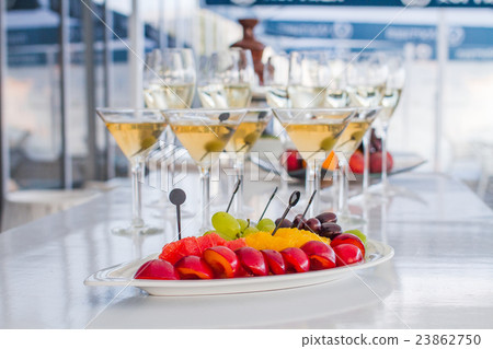 Wine glasses with fruit on the table Wine glasses with fruit on the table 23862750
