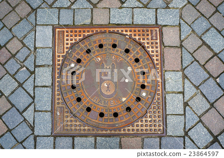 Sewer manhole in city Hameln, Germany. 23864597