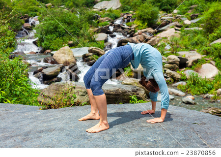 Woman doing Ashtanga Vinyasa Yoga asana Urdhva 23870856