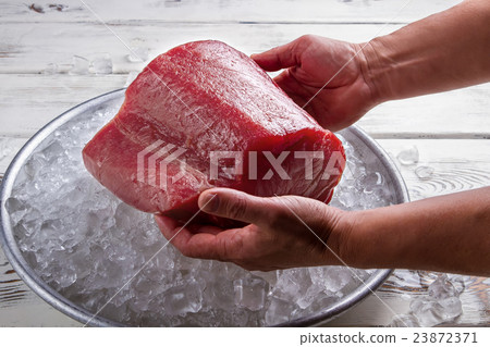 Male hands hold fish meat. Male hands hold fish meat. 23872371