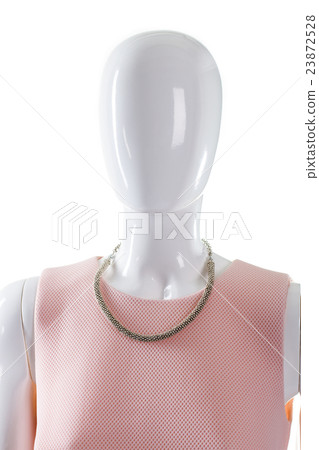 Necklace on mannequin's neck. 23872528