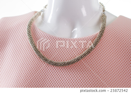 Delicate metal necklace on mannequin. 23872542