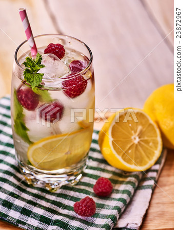 Raspberry mojito with cubes ice glass. 23872967