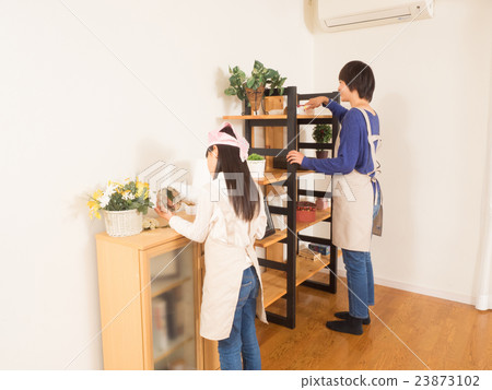 Mother girl cleaning the shelf with mop 23873102