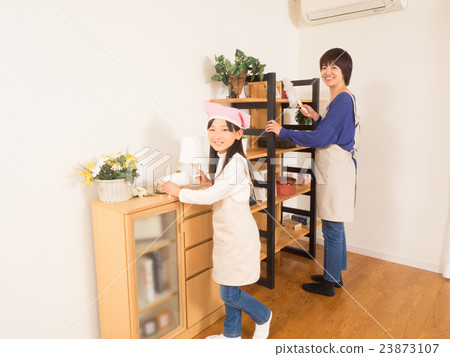 Mother girl cleaning the shelf with mop 23873107