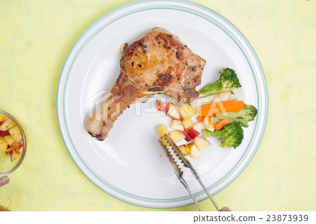 Chef decorated pork chop steak 23873939