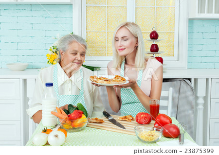 Grandmother and woman housewife. 23875399