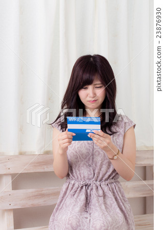 A woman with a passbook 23876930