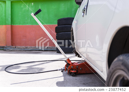 Car jack to lifting the car for replace wheel and Car jack to lifting the car for replace wheel and 23877452
