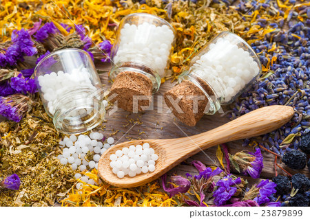 Bottles of homeopathy globules Bottles of homeopathy globules 23879899