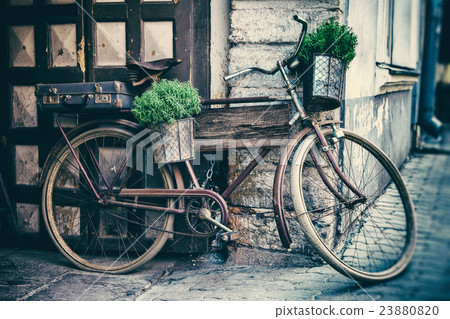 Old bicycle carrying flower pots  23880820