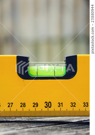 Bubble spirit water level tool on wooden board Bubble spirit water level tool on wooden board 23880944