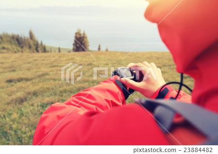 checking the altimeter on sports watch 23884482