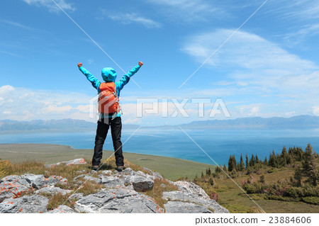 successful woman backpacker hiking mountain peak successful woman backpacker hiking mountain peak 23884606