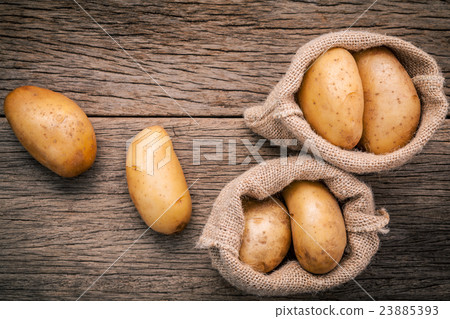 Fresh organic potatoes in hemp sake bag. 23885393