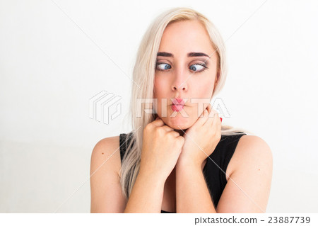 Crazy blonde woman makes squint for fun Crazy blonde woman makes squint for fun 23887739