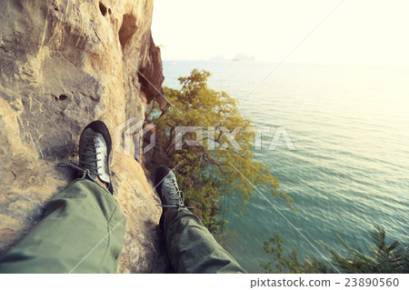 climber legs at seaside rock 23890560