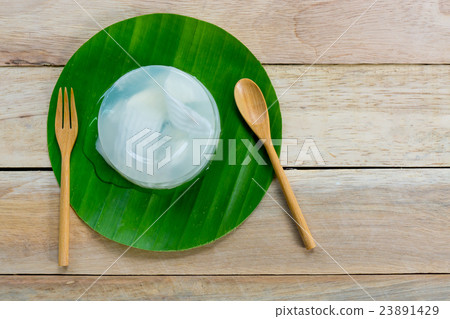 coconut jelly and wooden spoon on wooden backgroun 23891429