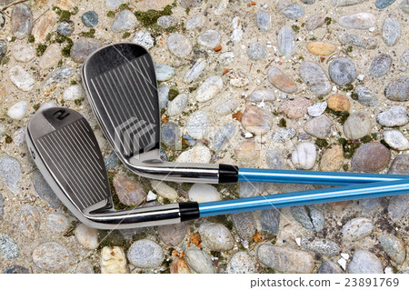 Golf clubs on footpath Golf clubs on footpath 23891769