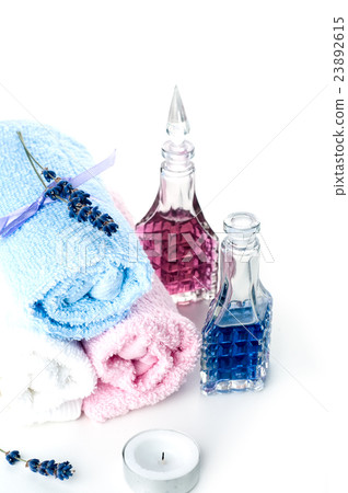 colorful stones and towel on a white background colorful stones and towel on a white background 23892615