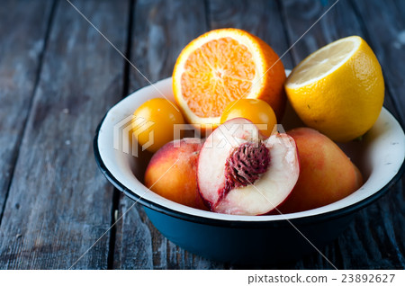 plate with peach, lemon and orange 23892627