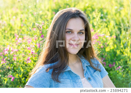 Portrait of girl of 16 years in flower meadow Portrait of girl of 16 years in flower meadow 23894271