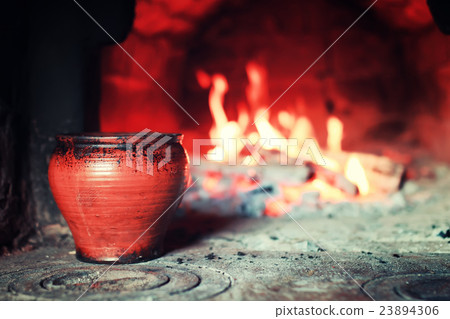 pot in the oven and oven fork 23894306