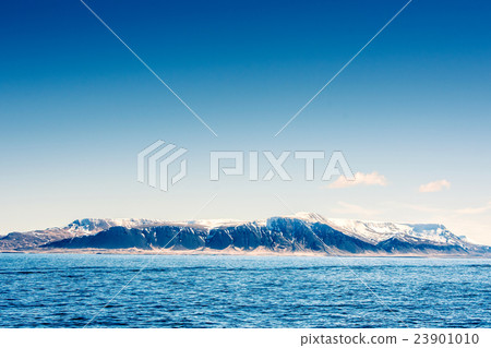 Snow on mountains in the blue ocean 23901010