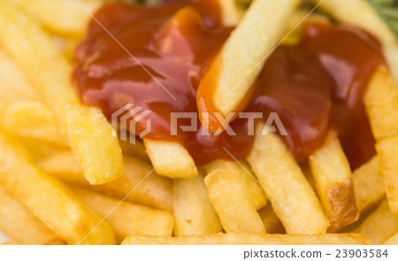 fried potatoes with ketchup 23903584