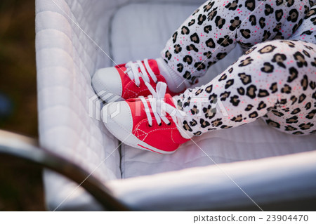 Little baby girl sleeping in carriage 23904470