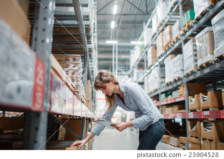 beautiful young hardware store worker stock taking beautiful young hardware store worker stock taking 23904528
