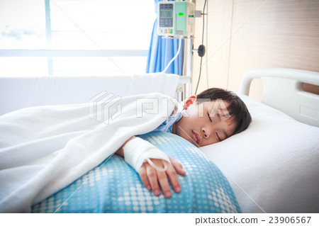 Asian boy lying with saline intravenous (IV).  23906567