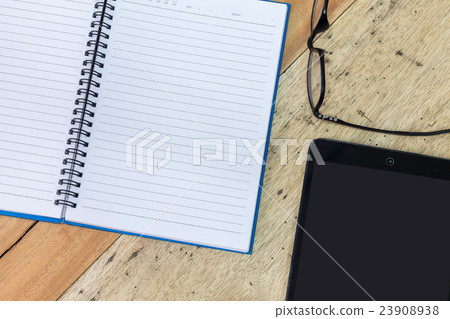 notebook, coffee, smartphone and pencil on wood 23908938