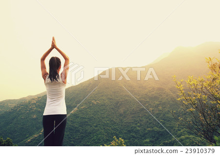 young fitness yoga woman at mountain peak young fitness yoga woman at mountain peak 23910379