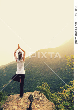 young fitness yoga woman at mountain peak young fitness yoga woman at mountain peak 23910380