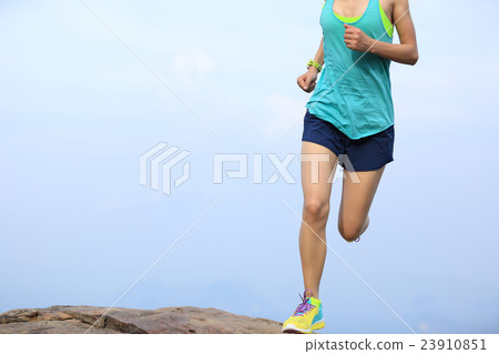 young asian woman runner running on mountain peak 23910851
