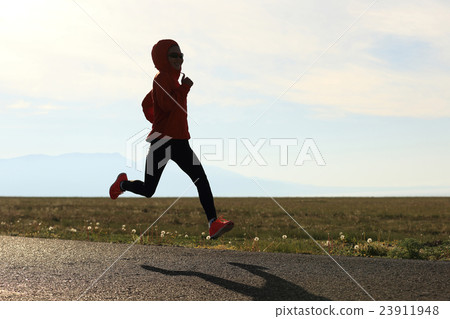 healthy   young woman runner running on trail 23911948