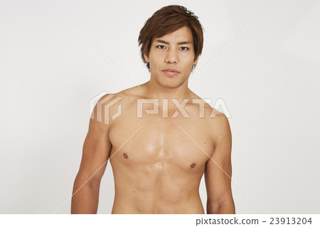 Macho young man showing muscle 23913204