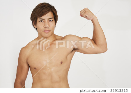 Macho young man showing muscle 23913215