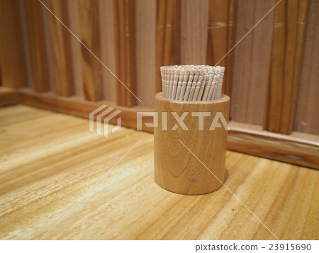 Toothpick in the box on a table 23915690
