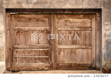 Old wooden door on the wall Old wooden door on the wall 23916277