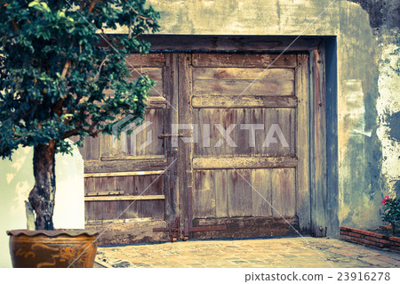 Old wooden door on the wall Old wooden door on the wall 23916278